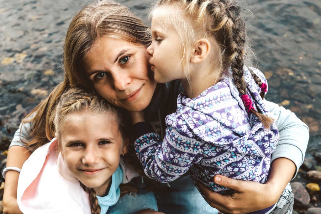 A young woman with two daughters