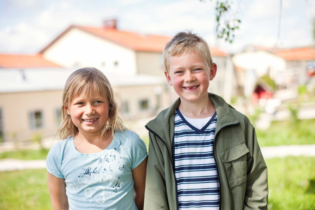 Portrait of happy brother and sister