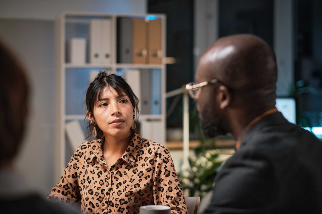 Woman talking to advisor at meeting